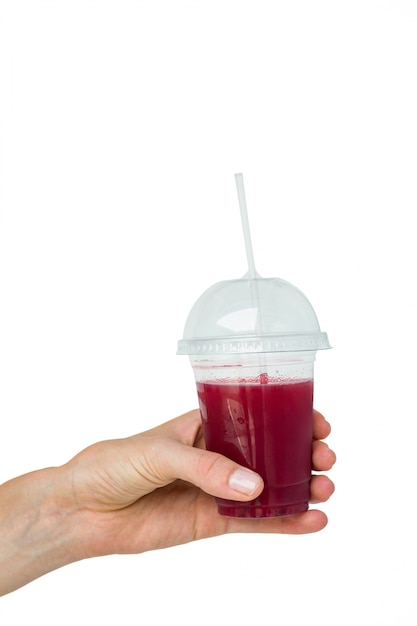 Hand holding healthy juice