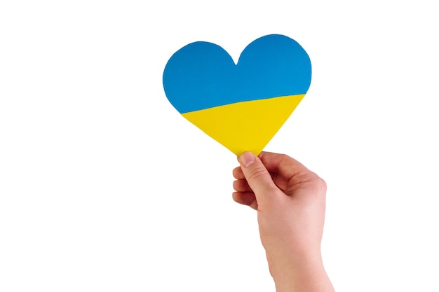 Hand holding a heart made from the flag of Ukraine blue yellow on an isolated white background