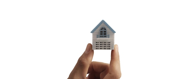 Hand holding house model property insurance and security Buy rent house concept