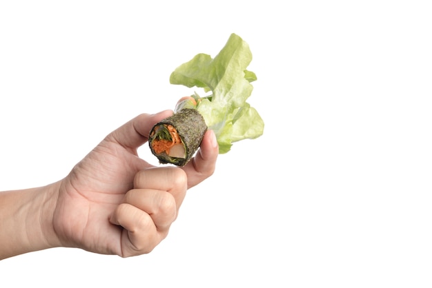 Hand holding hydroponics vegetable salad roll wrapped by seaweed