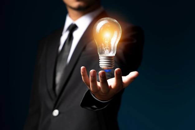 Hand of holding illuminated light bulb,innovation inspiration concept.business idea