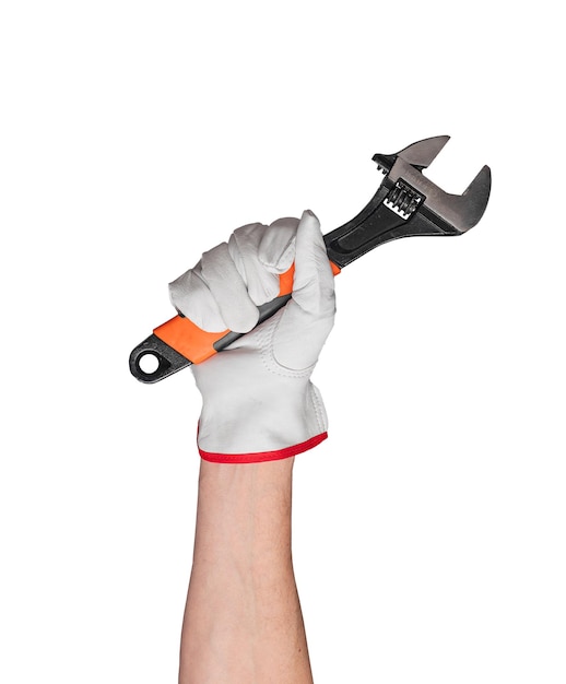 Hand holding metallic wrench in construction work Industrial manual tool for repair and maintenance