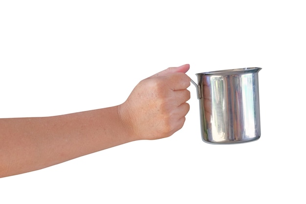 Hand holding milk pitcher isolated on white background