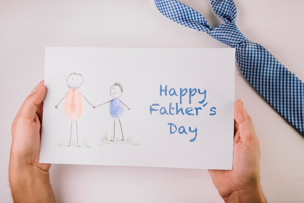 Photo hand holding paper for fathers day