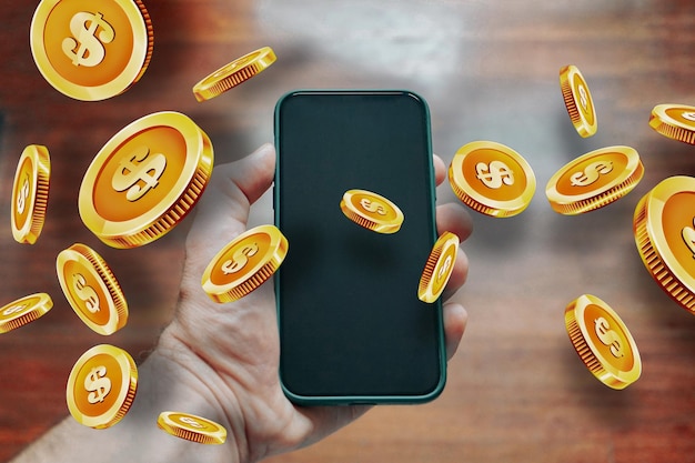 hand holding a phone with coins on the screen