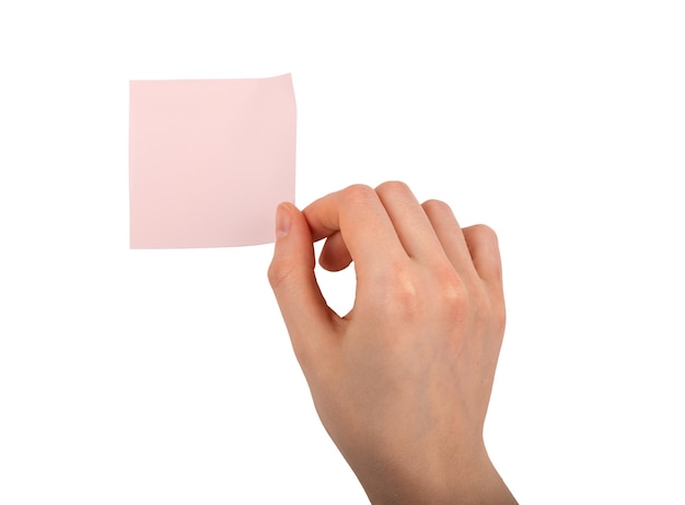 Hand holding pink sticky notes blank memo sticker isolated on white