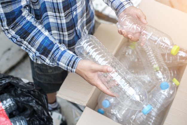 Hand holding recyclable plastic bottle