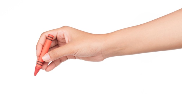 hand holding red crayon isolated on white background