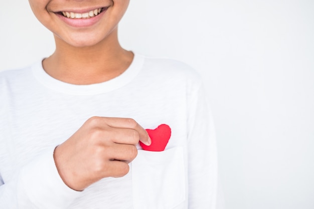 hand holding a red heart