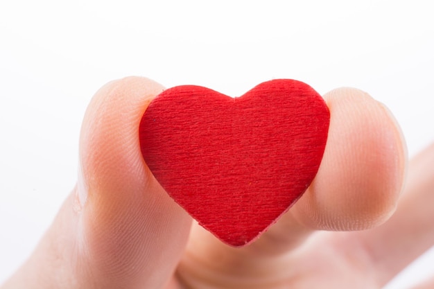 Hand holding a red heart