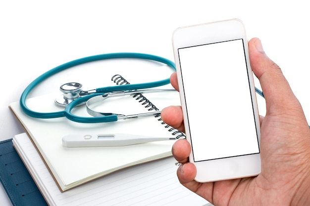 hand holding a smartphone on a medical instrument background