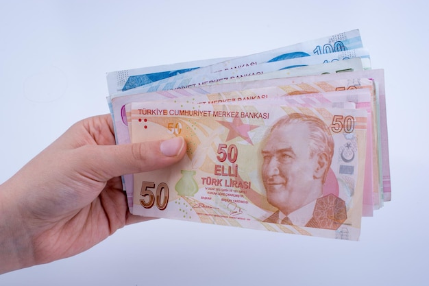 Hand holding Turksh Lira banknotes in hand