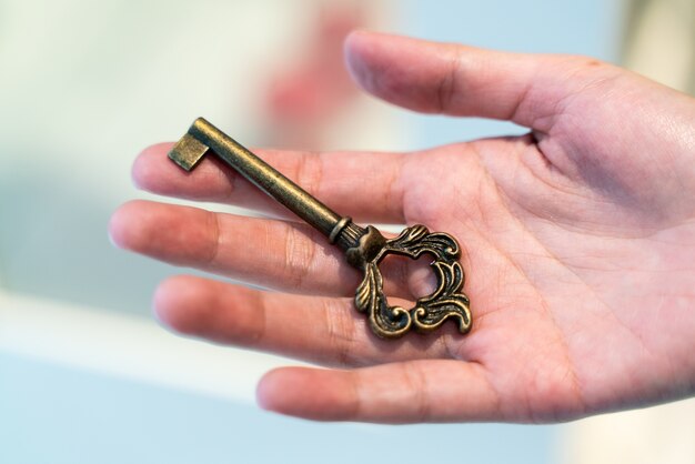 Hand Holding Vintage Key