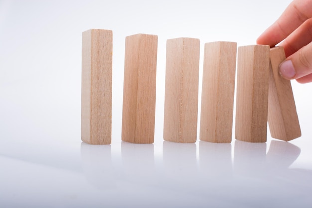 Hand holding wooden domino