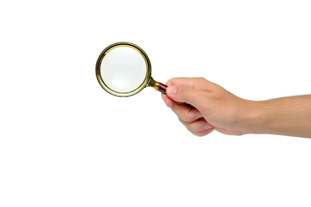 Hand holds magnifying glass an isolate on white background