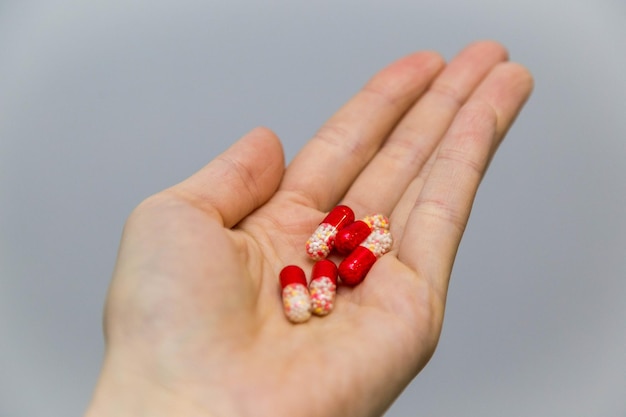 hand holds medicine pills