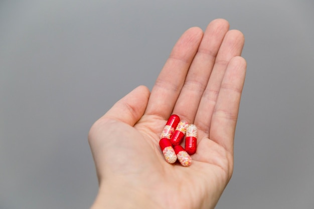 hand holds medicine pills