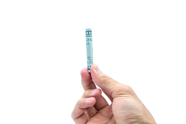 A hand holds one hundred dollars twisted into a tube, on a white background.