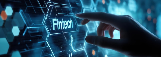 A hand interacting with a futuristic digital screen featuring fintech concepts and technological innovation