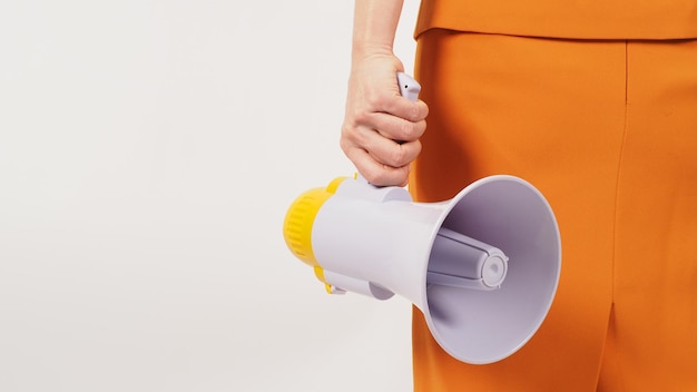 The hand is holding a megaphone and wearing a yellow mustard suit on white background The hand attachment body turn around