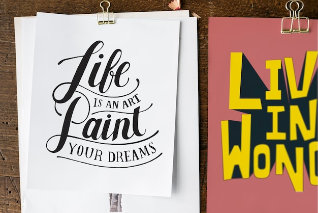 Hand lettering of motivation quote on sketch sheets