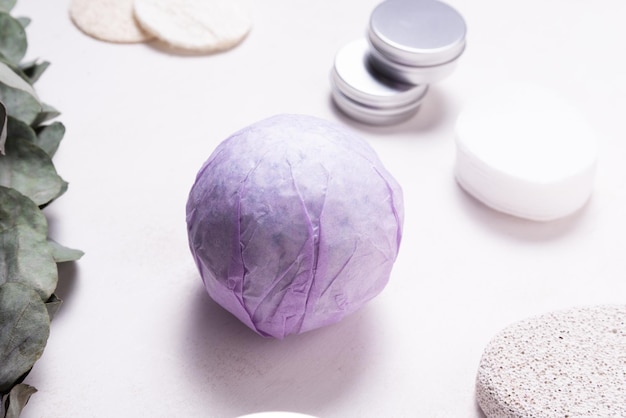 Hand made bath sea salt ball bomb on wooden table