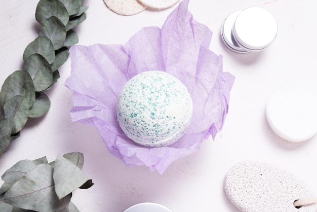 Hand made bath sea salt ball bomb on wooden table