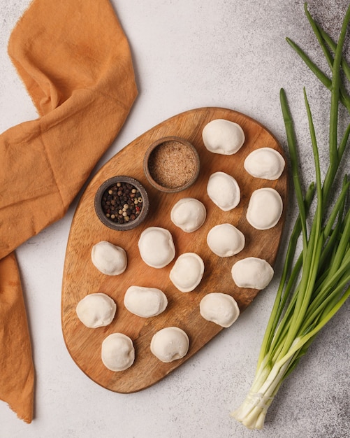 Hand-made dumplings. Cooking dumplings. Cooked dumplings with herbs and vegetables