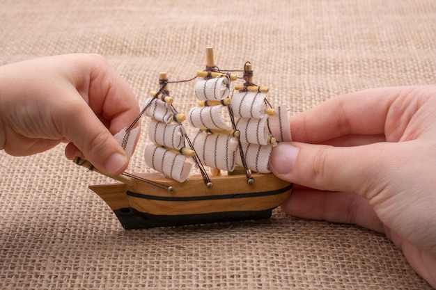 Hand made sail boat in hand