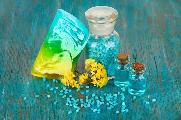 Hand made soap with sea salt on wooden table closeup