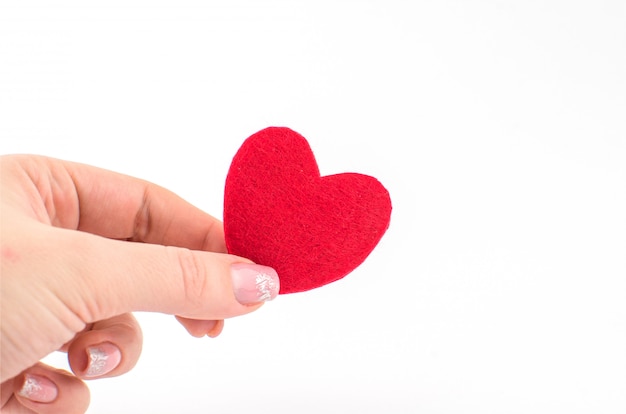 Hand made textile red heart. Isolated on white background