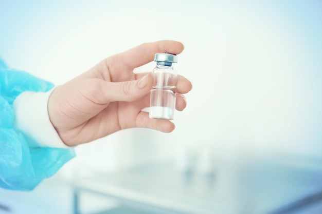 Hand of nurse with medicine prepared for vaccination in clinic