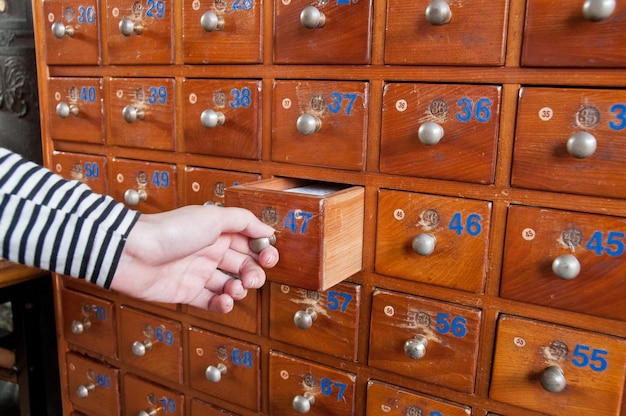 Hand opening wooden medicine box closet