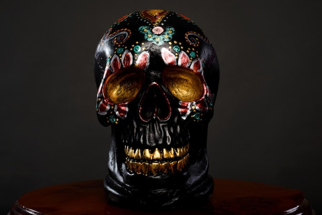 Hand painted plaster skull. Decorative caravel for Day of the Dead celebration.