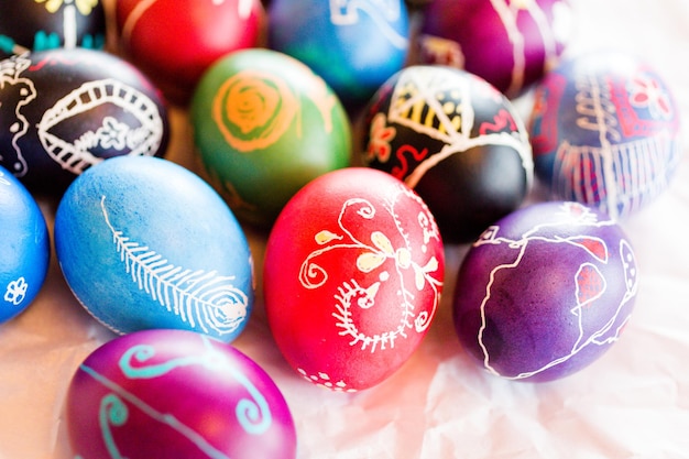 Hand painted Ukrainian Easter eggs decorated with folk designs using a wax resist method.