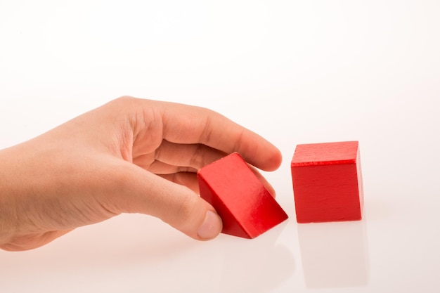 Hand playing with cubes