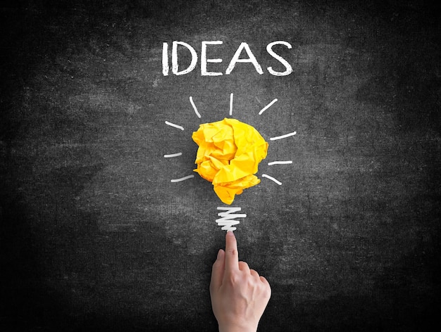 Hand point to light bulb Creativity concept for good ideas