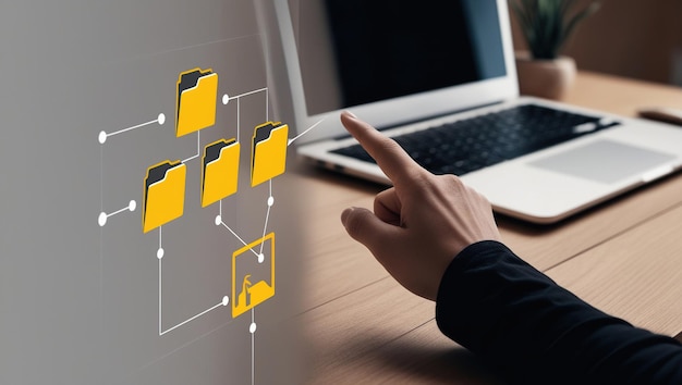 A hand points to a digital network of folders on a computer screen representing data management and organization