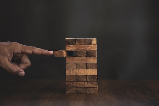 Hand push wooden block tower stack in tower shape