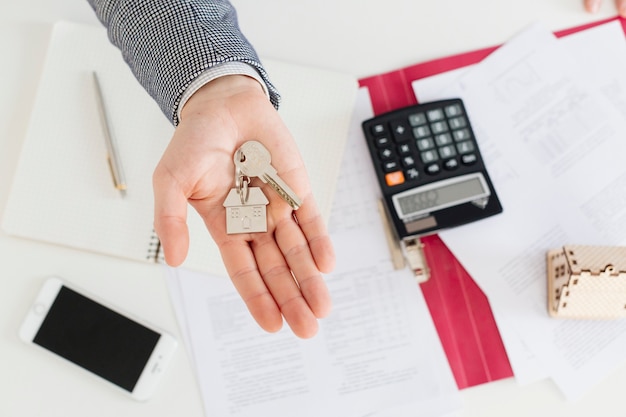 Hand of realtor with keys