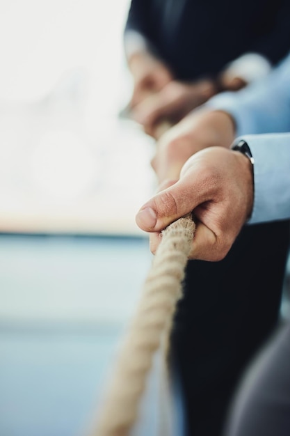 Hand rope and business people with tug of war game for team building and collaboration competition and mockup Corporate conflict resolution challenge and teamwork with employees in workplace