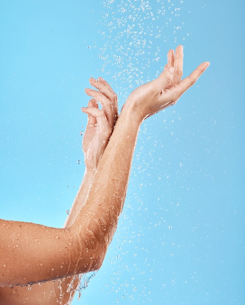 Hand shower and water with a woman cleansing her body for skincare bodycare and washing Hygiene grooming and showering female arm for health wellness and skin care body care and hydration