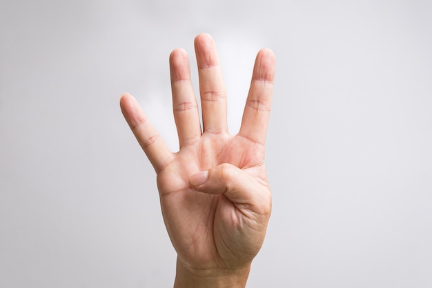 Hand showing four fingers