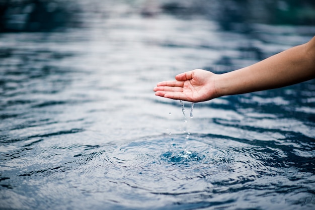 The hand that touches the blue water