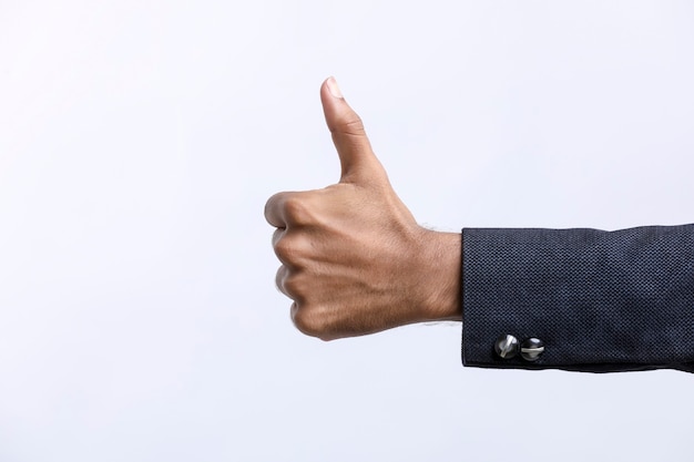 Hand thump up sign isolated on white background.