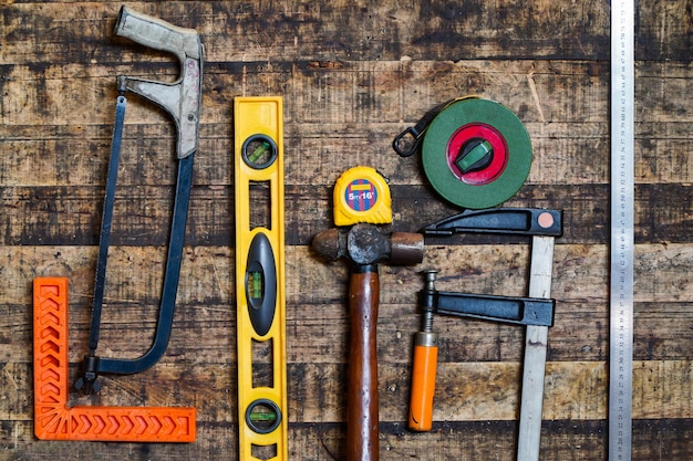 Photo hand tools are on the wooden table