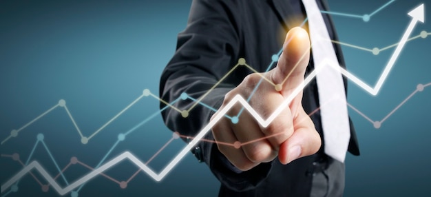 Hand touching a graph of financial indicator and accounting market economy analysis chart