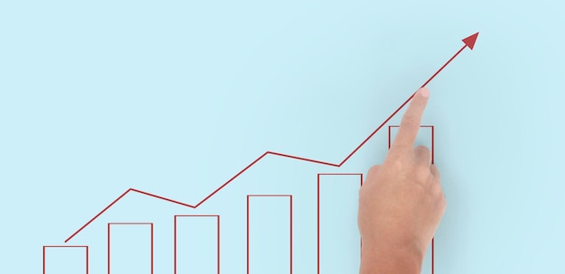 Hand touching graphs of financial indicator and accounting market