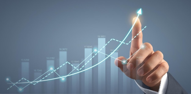 Hand touching graphs of financial indicator market analysis chart