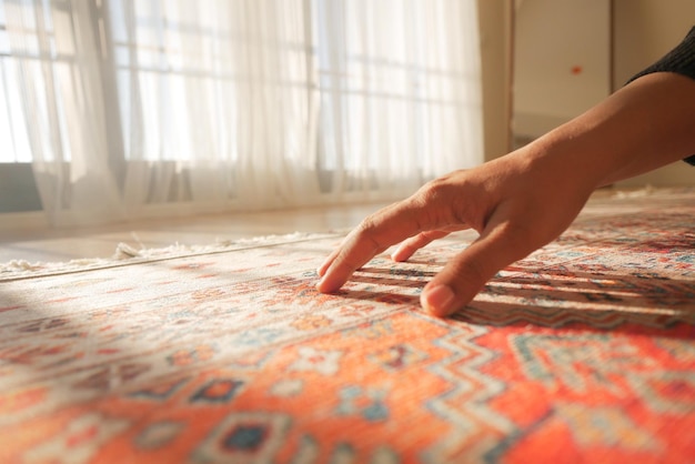 hand touching new home carpet